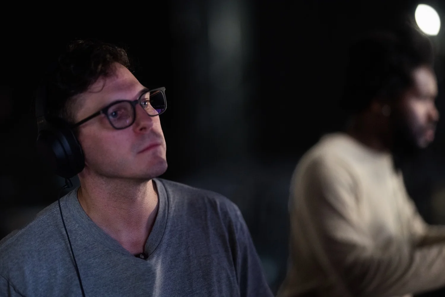 Paul Becker directing, wearing headphones