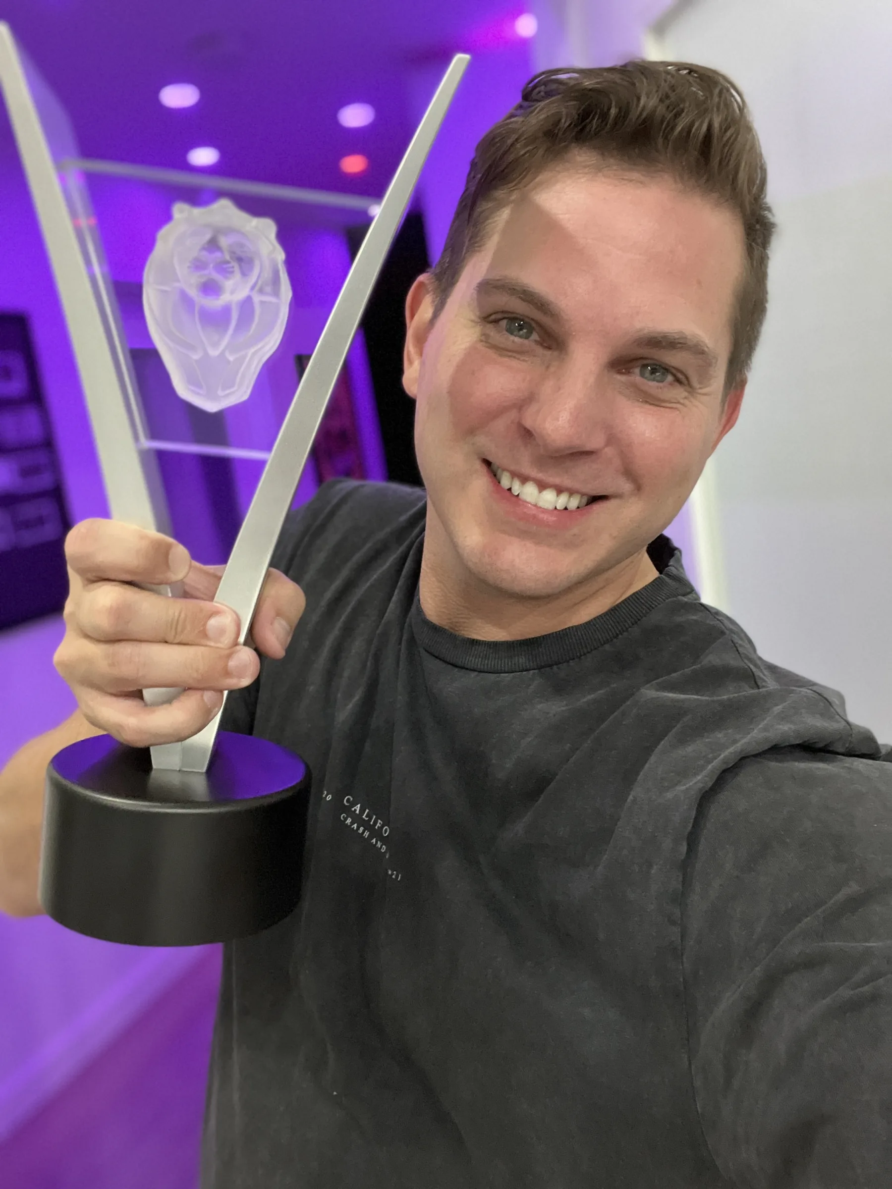 Paul Becker holding his Leo Award