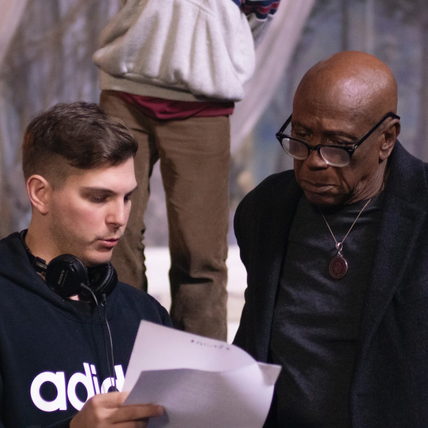 Paul directing Louis Gossett Jr. on the set of Breaking Brooklyn